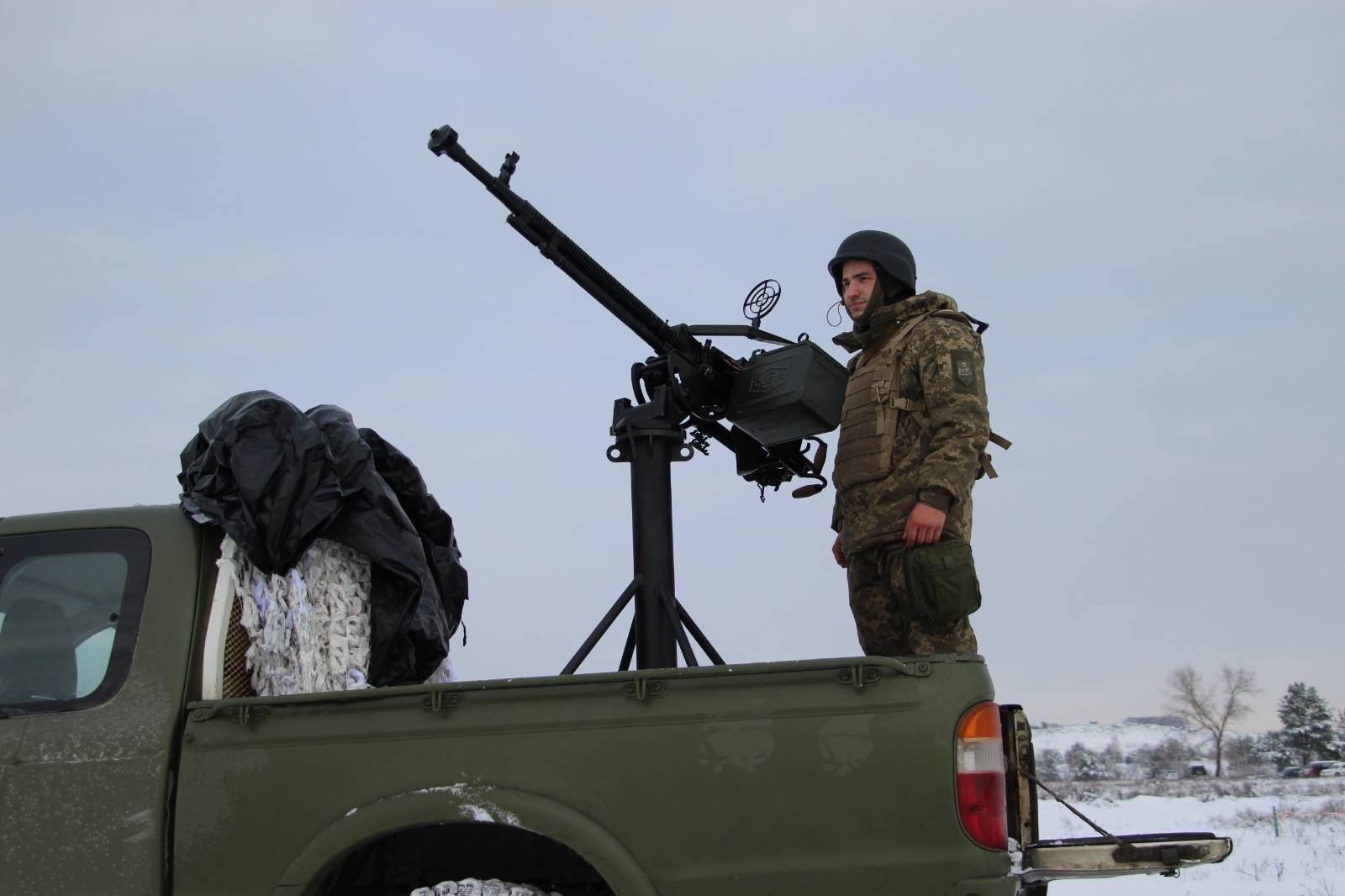 Пікап з установленим кулеметом ДШКМ українських військових. Грудень 2022. Україна. Фото: Тероборона